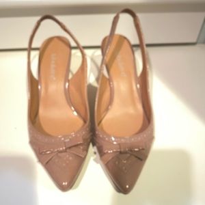 Nude colored kitten heels with bow accent. Almost new!